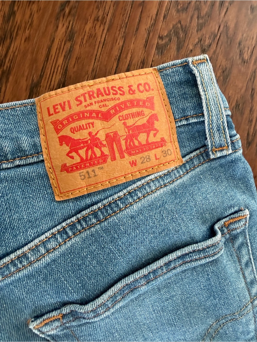 Levi's Slim Straight Blue Jeans with Tan Leather Patch